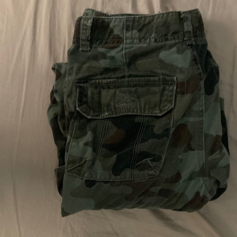 Camo jeans, tight boot cut. Missing a button